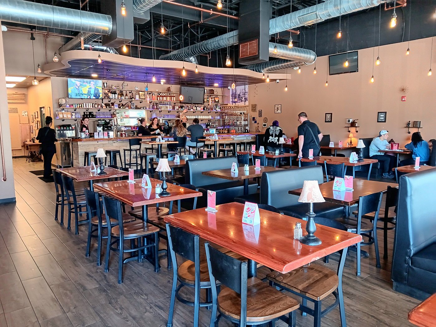 Interior of cozy coffee restaurant with bar in the back